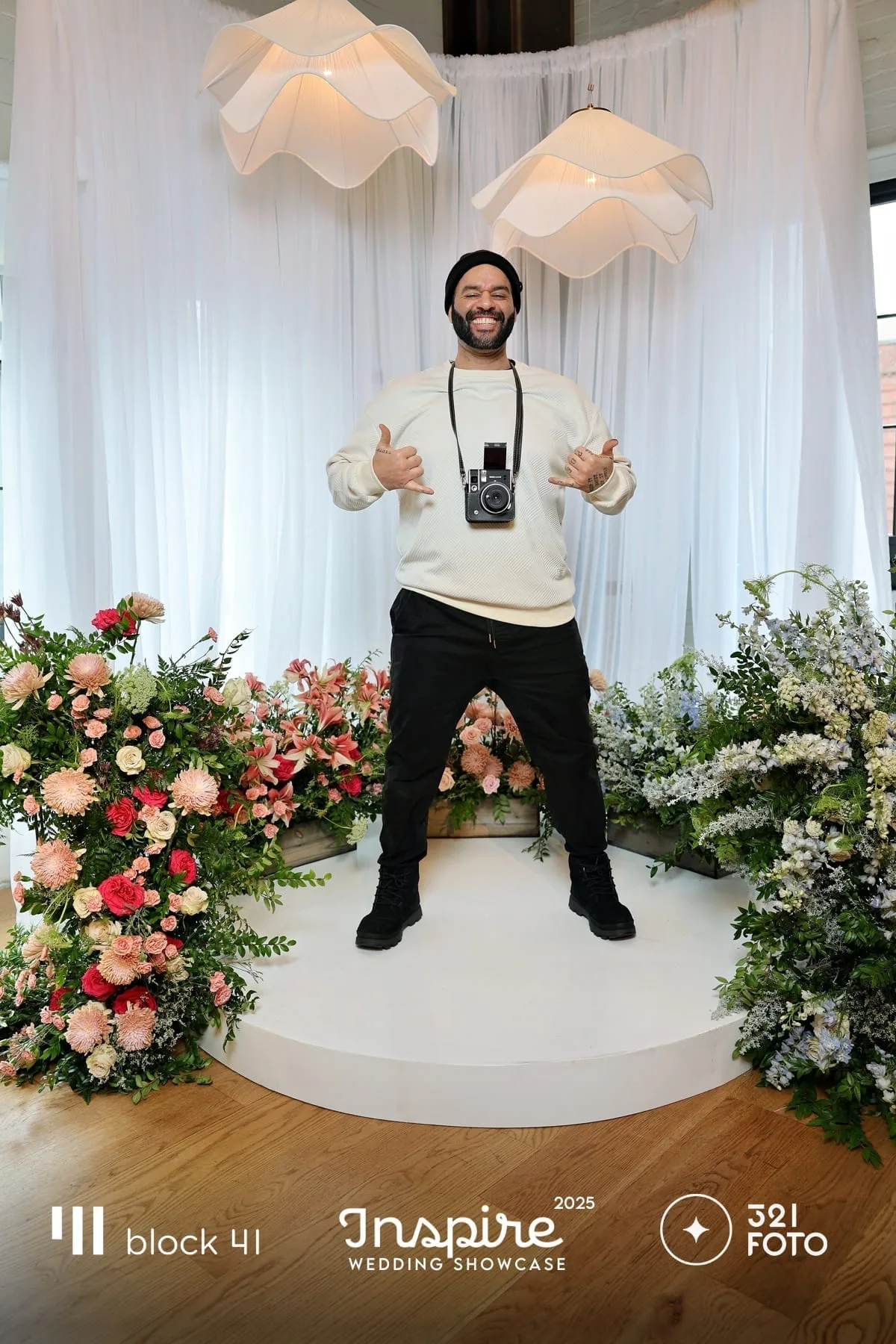 Spoken-word performer at a microphone in a poetry or live literature setting.